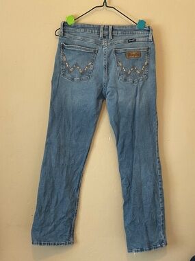 Wrangler blue denim jeans with embroidered W back pockets